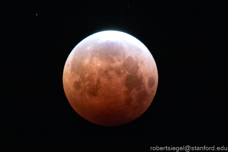 jet in front of lunar eclipse